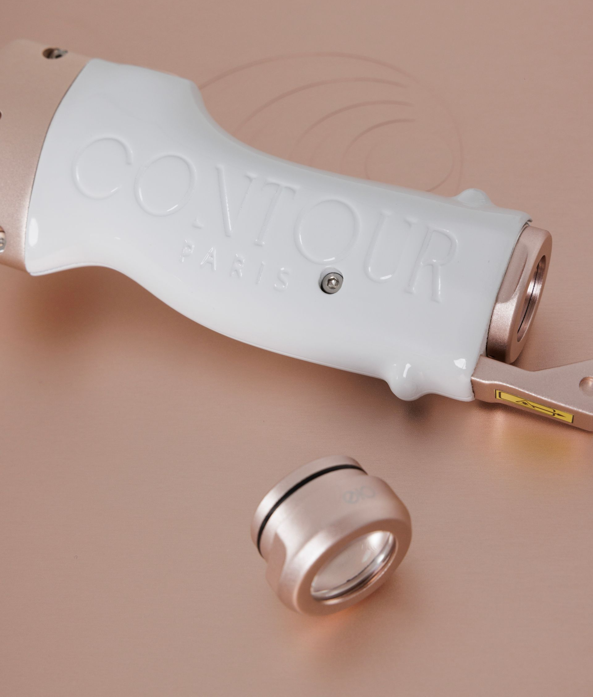 Appareil d'épilation laser « CONTOUR » blanc et or rose.