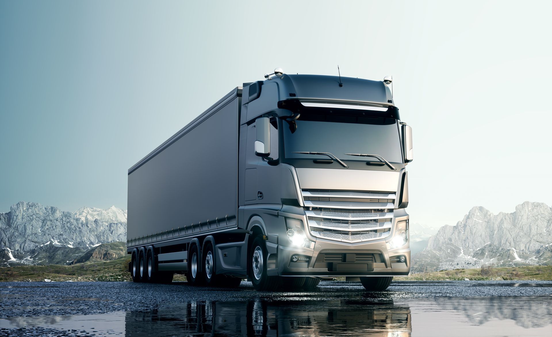 Un camion semi-remorque sur sol mouillé