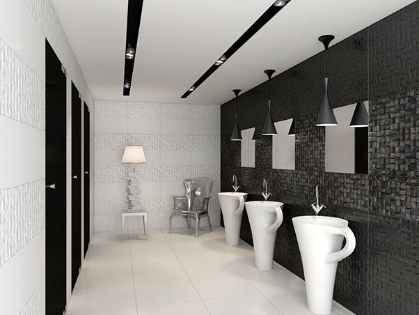 Un baño con muchos lavabos y espejos.