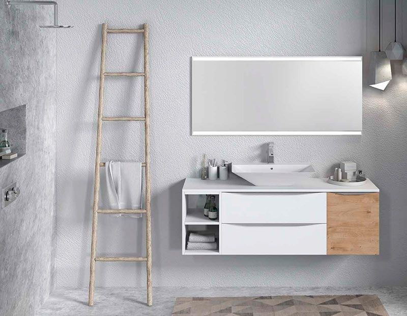 Un baño con lavabo, espejo y escalera.