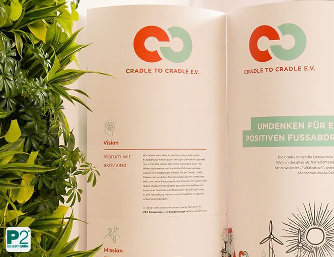 Vision der Cradle to Cradle Denkschule mit Pflanzen im Hintergrund.