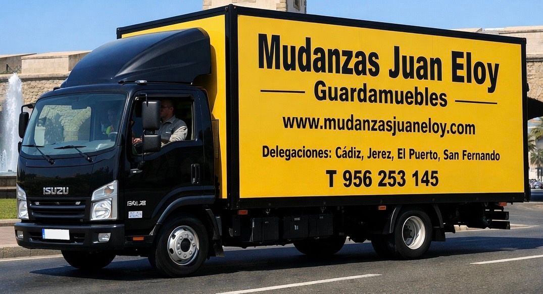 Camión de mudanzas negro y amarillo con 