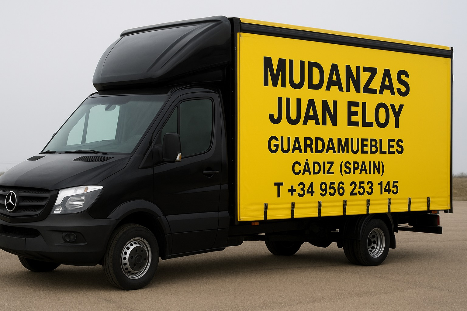 Camión de mudanzas Mercedes negro con panel lateral amarillo publicitario 