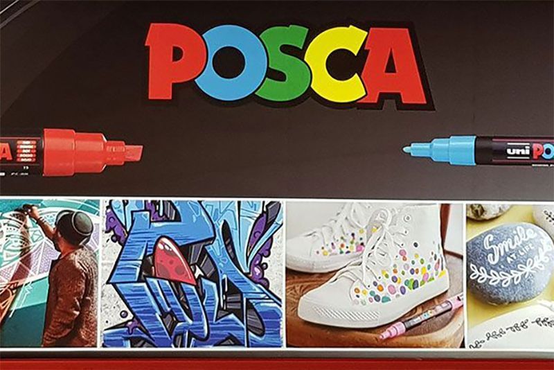 Eine Schachtel Posca-Marker mit einer Collage aus Bildern