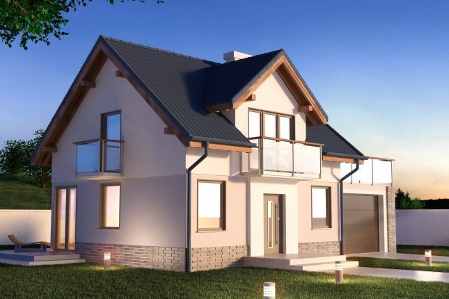 Maison moderne à deux étages avec un revêtement extérieur beige, un toit foncé et une petite véranda au crépuscule