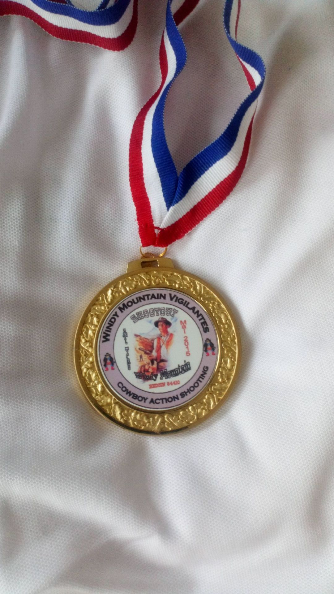 Médaille cowboy action shooting.