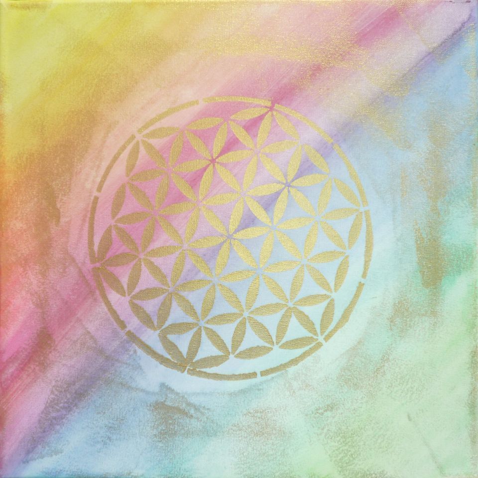 Ein Gemälde einer Blume des Lebens auf einem Regenbogenhintergrund.