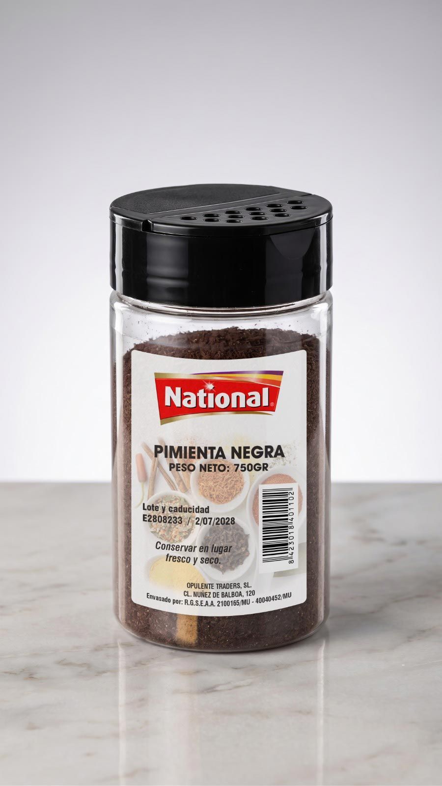 Tarro de especias transparente con tapa negra, etiquetado como 