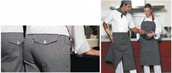 Un hombre y una mujer están de pie en una cocina con delantales.