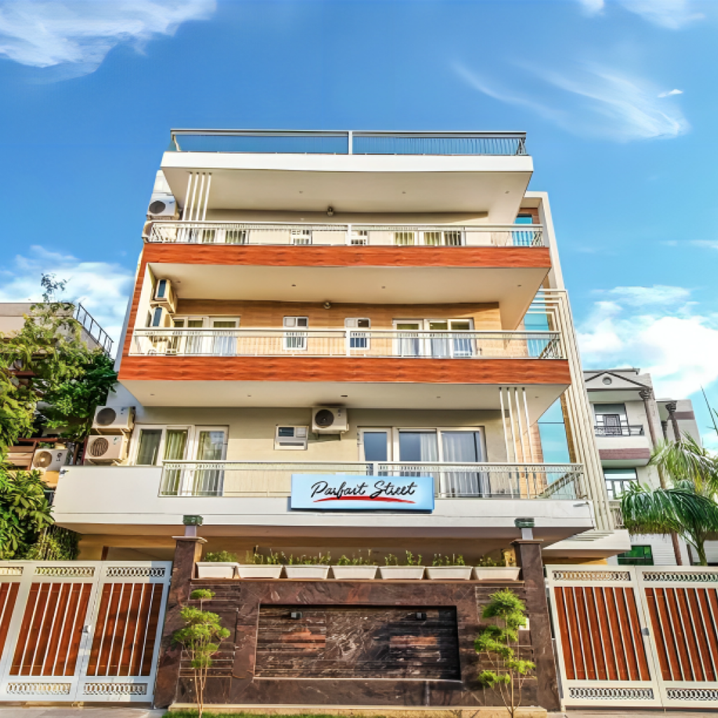 Modern building with balconies, featuring Access friendly 2BHK & 3BHK serviced apartments