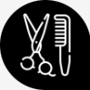 Ícone de tesoura e pente em fundo preto.