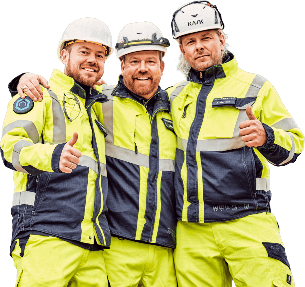 Three construction workers in reflective jackets and hard hats.