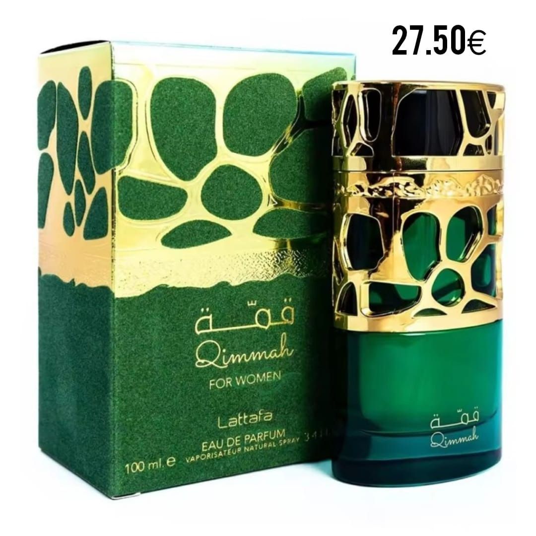 Una botella de perfume verde junto a una caja dorada