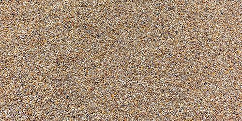 Eine Nahaufnahme eines Sandhaufens an einem Strand.