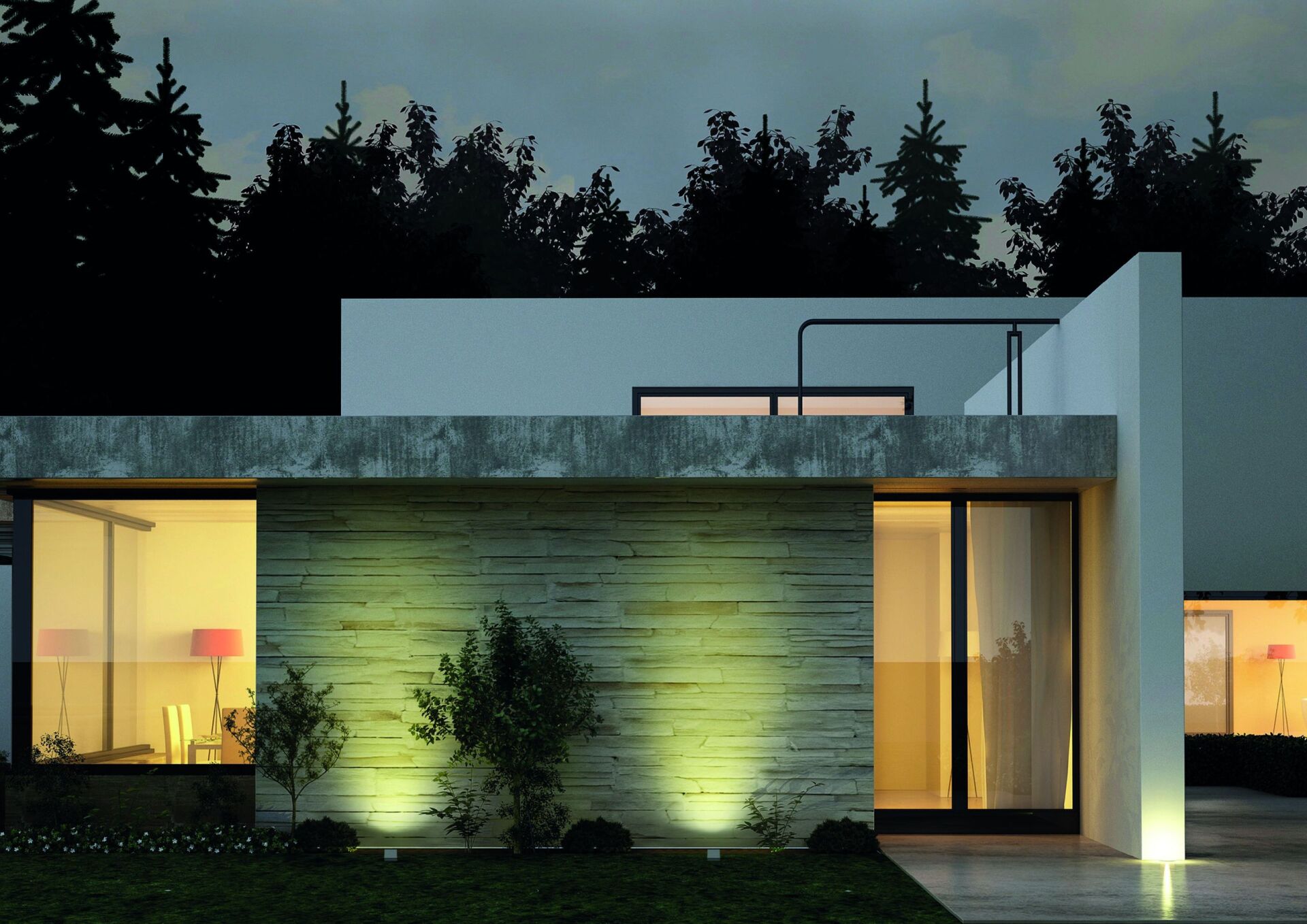 Ein Haus mit vielen Fenstern ist nachts beleuchtet