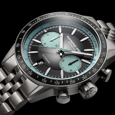 Graue und türkisfarbene Raymond Weil-Uhr mit Hilfszifferblättern und Tachymeterlünette.