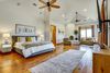 Luxury bedroom suite with sitting area at Post Oak Estate
