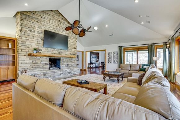 Large living room with fireplace at Post Oak Estate