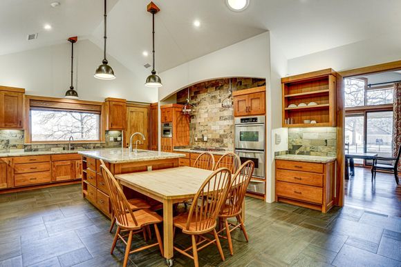 Large gourmet kitchen and dining area at Post Oak Estate luxury retreat