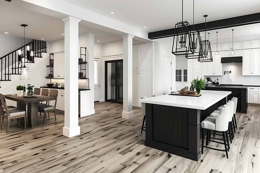 Eine Küche und ein Esszimmer in einem Haus mit einer großen Insel in der Mitte.