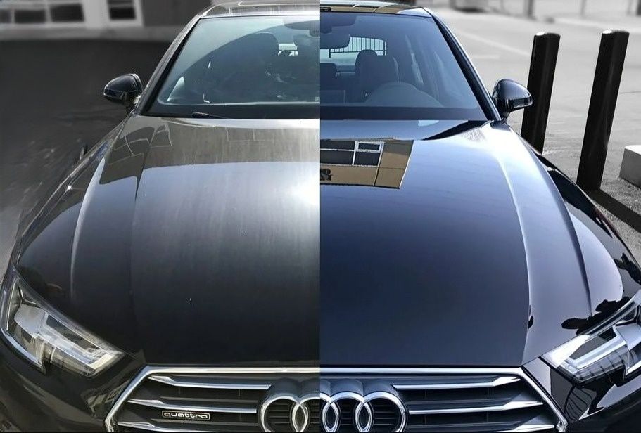 Un capó de un automóvil Audi negro, mitad sucio y mitad limpio, que muestra los detalles.