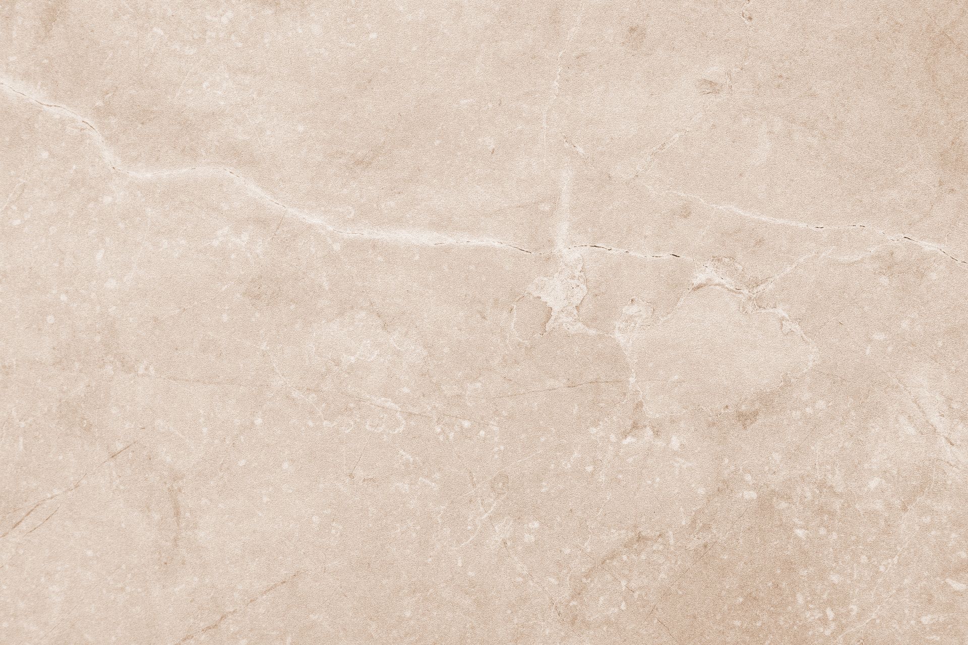 Texture pierre beige fissurée.