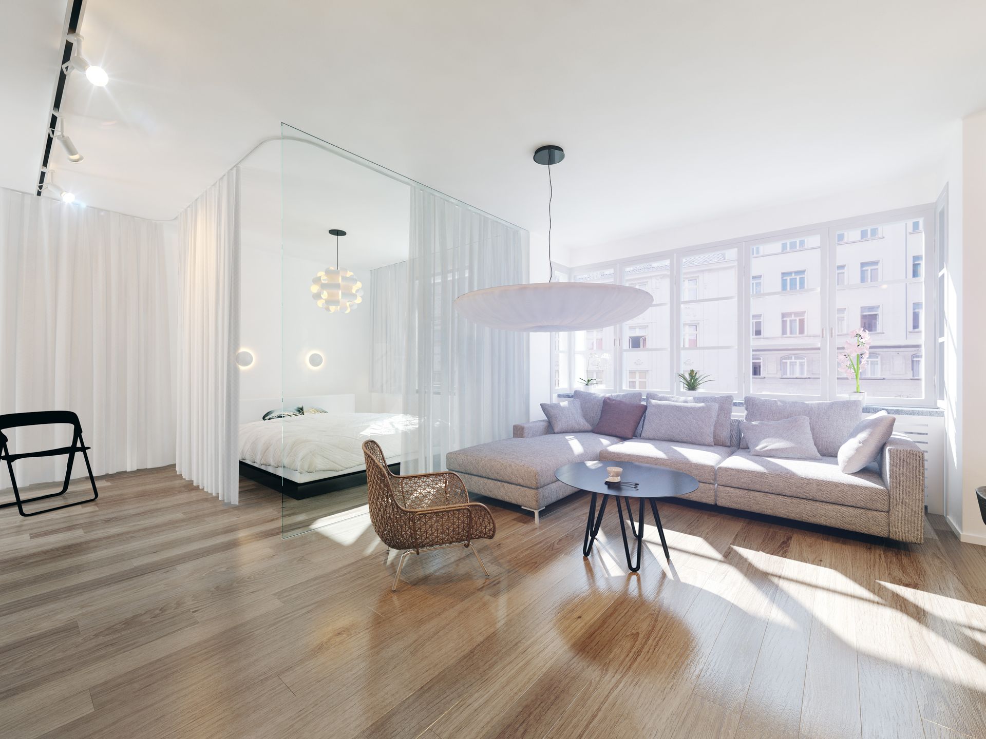 Espace de vie lumineux et moderne avec une chambre séparée par une paroi de verre, un canapé et de grandes fenêtres.