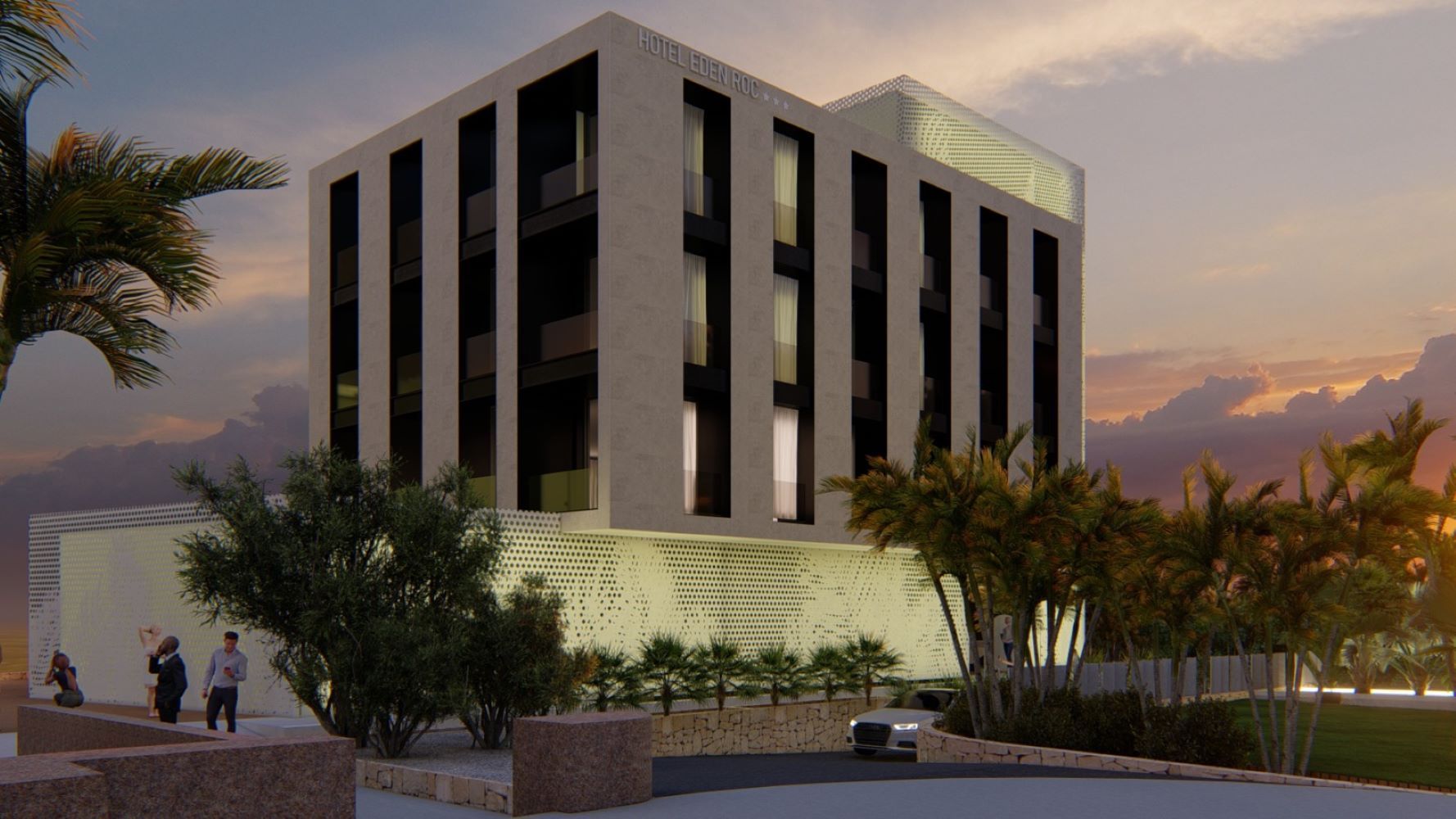 Un gran edificio blanco con muchas ventanas está rodeado de palmeras.