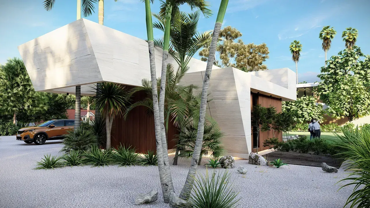 Un coche está aparcado delante de una casa rodeada de árboles.