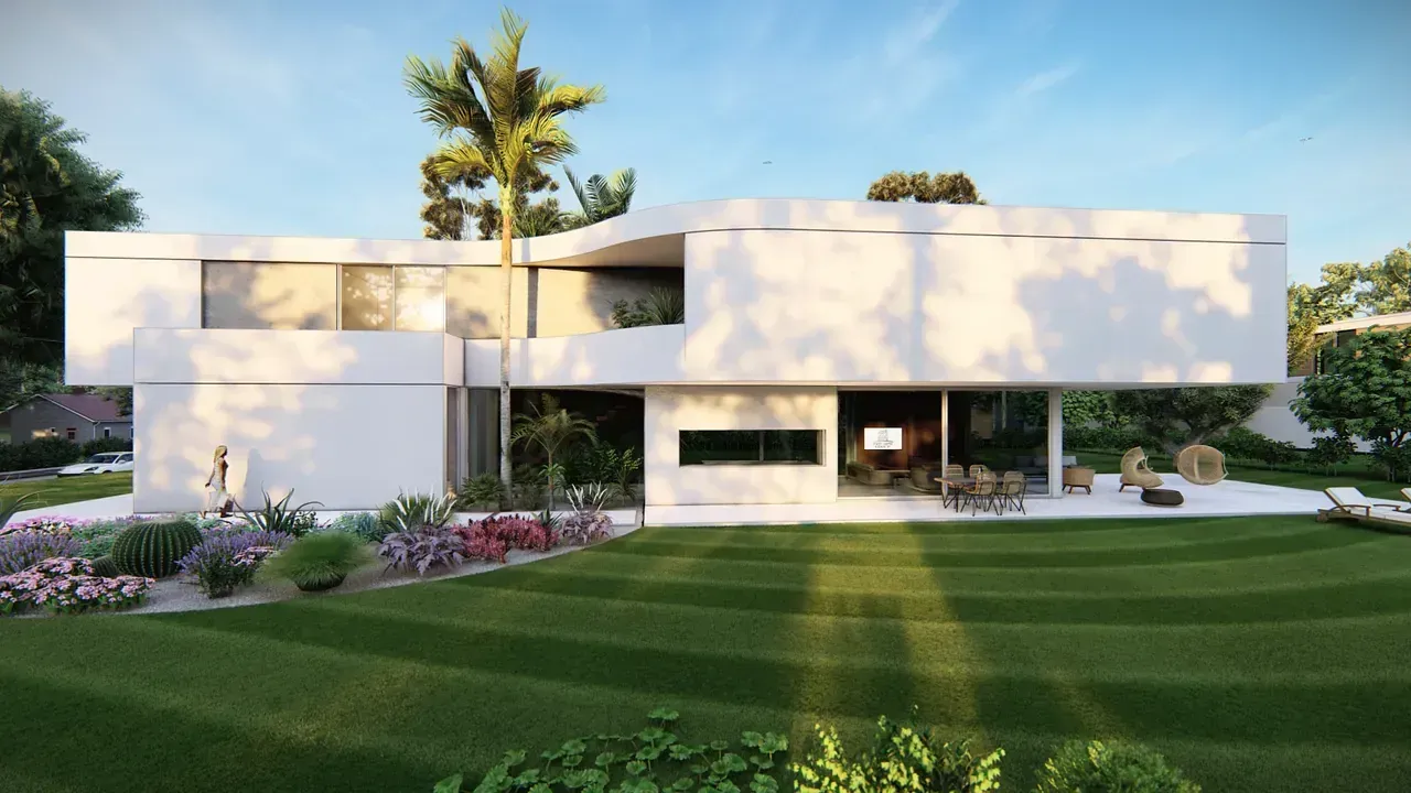 Una gran casa blanca con un amplio césped delante de ella.