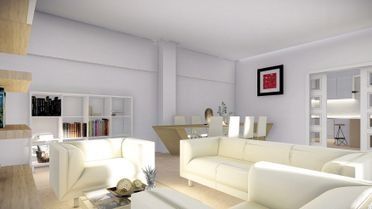 Luminoso salón moderno con sofás blancos, estanterías y un pequeño comedor bañado por una suave luz natural.