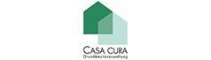 Das Logo von Casa Cura ist ein grünes Haus auf weißem Hintergrund.