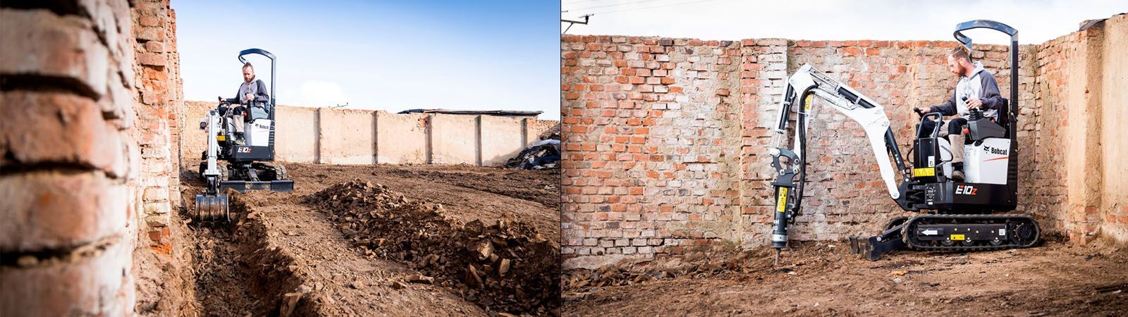 Una pequeña excavadora está cavando un agujero delante de una pared de ladrillos.