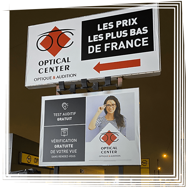 Optical Center storefront signs in French, including a large Les prix les plus bas de France billboard.