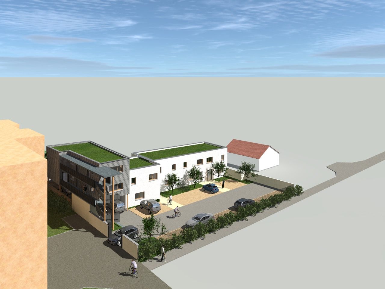Vue aérienne d'un petit complexe immobilier autour d'une cour intérieure, avec des façades blanches et brunes, des toits verts et des voitures garées.