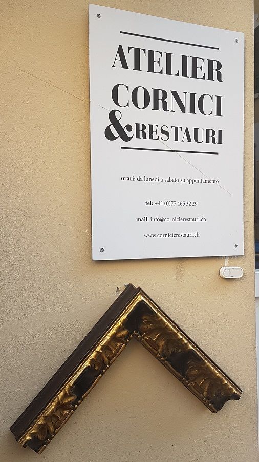 insegna del laboratorio per la riparazione di cornici - Atelier Cornici e Restauri