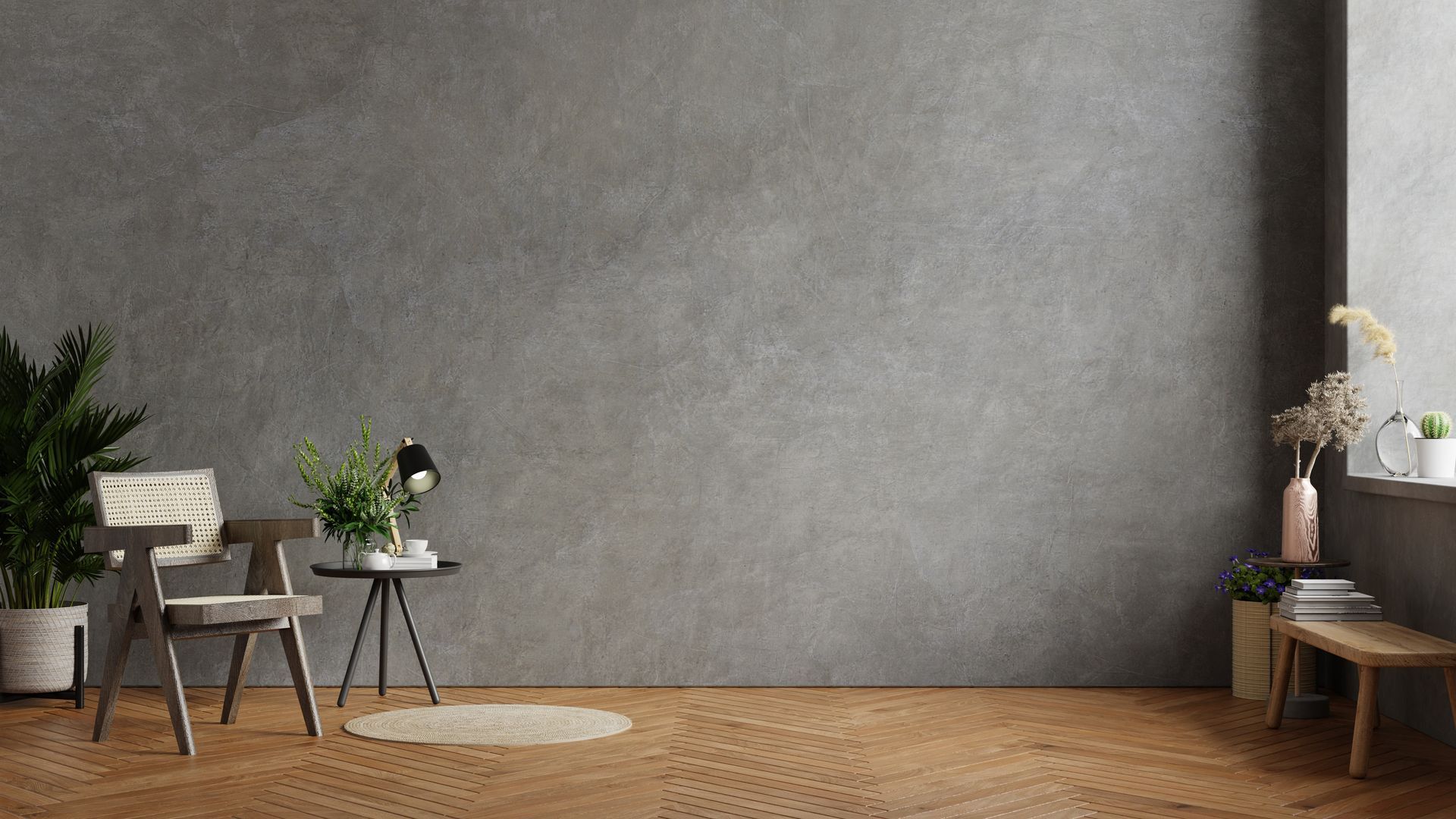 Minimalistisches, modernes Zimmer mit grauer Wand, Holzboden, kleinen Stühlen, Pflanzen und Beistelltischen.
