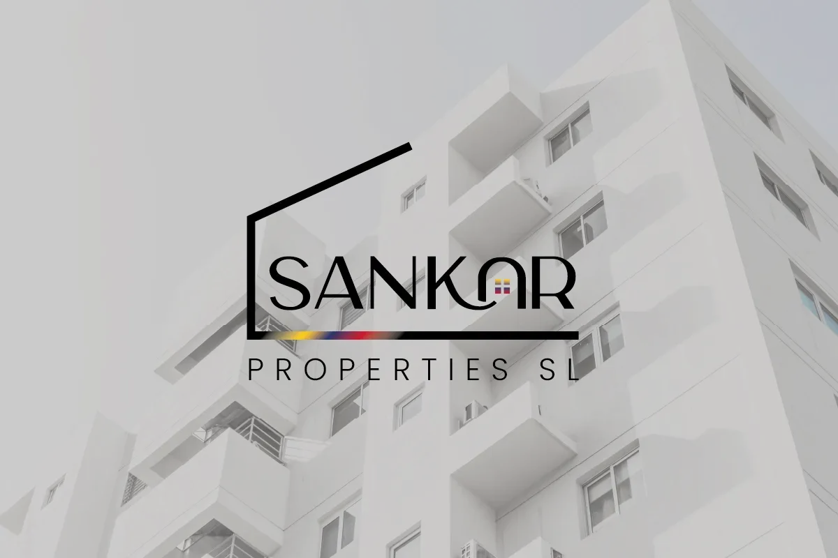 Logotipo de Sankar Properties sobre un fondo blanco de un edificio de apartamentos.