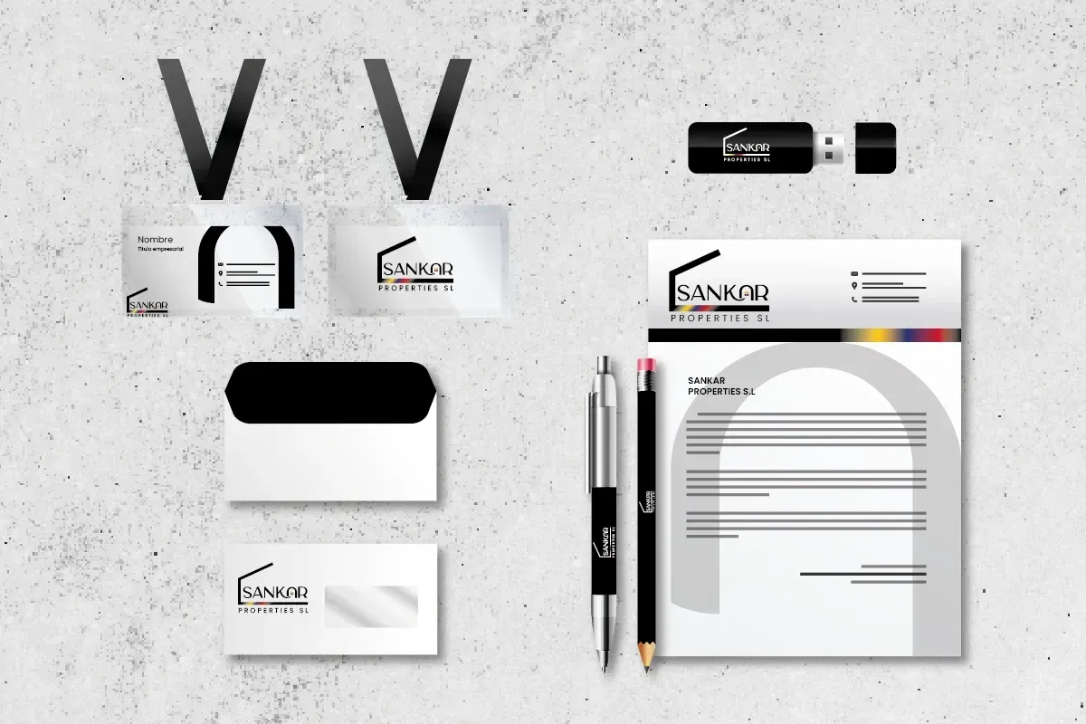 Maqueta de papelería corporativa en blanco y negro con logotipo