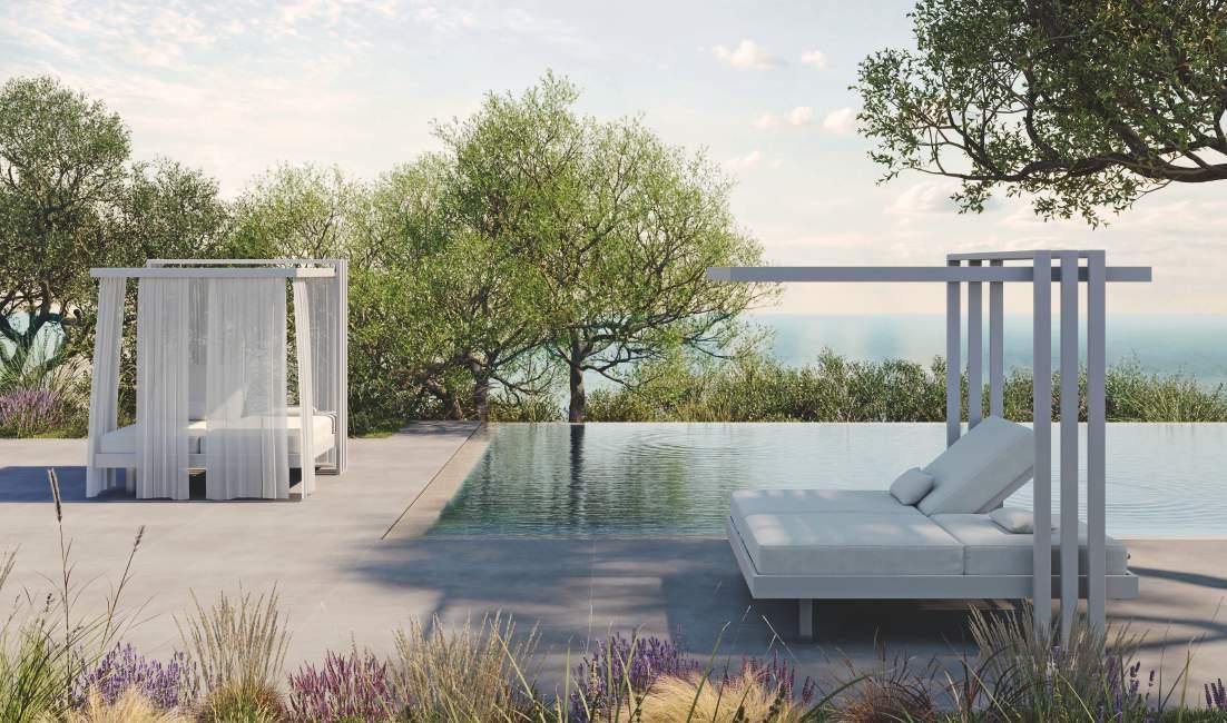 Hay una piscina con una cama con dosel al fondo.