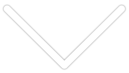 Flèche blanche en forme de chevron pointant vers le bas, aux coins arrondis.