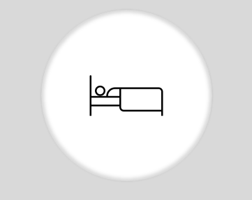 Una persona está acostada en una cama en un círculo.