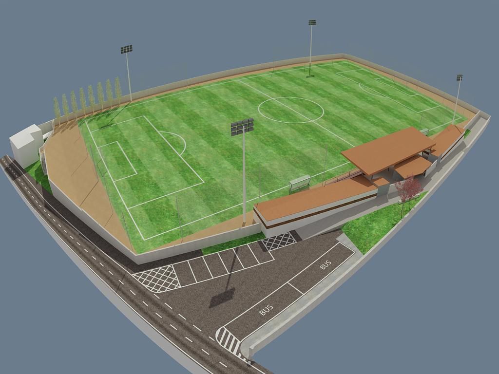 Una vista aérea de un campo de fútbol con un estadio al fondo.