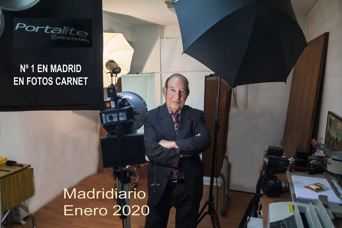 Man in a photography studio with equipment; text says 