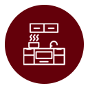 Un icono lineal blanco que representa una encimera de cocina con fogones, fregadero y armarios superiores, centrado en un círculo rojo oscuro sólido.