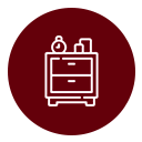 Un icono blanco de una mesita de noche con dos cajones y objetos encima, centrado en un círculo rojo oscuro sólido.