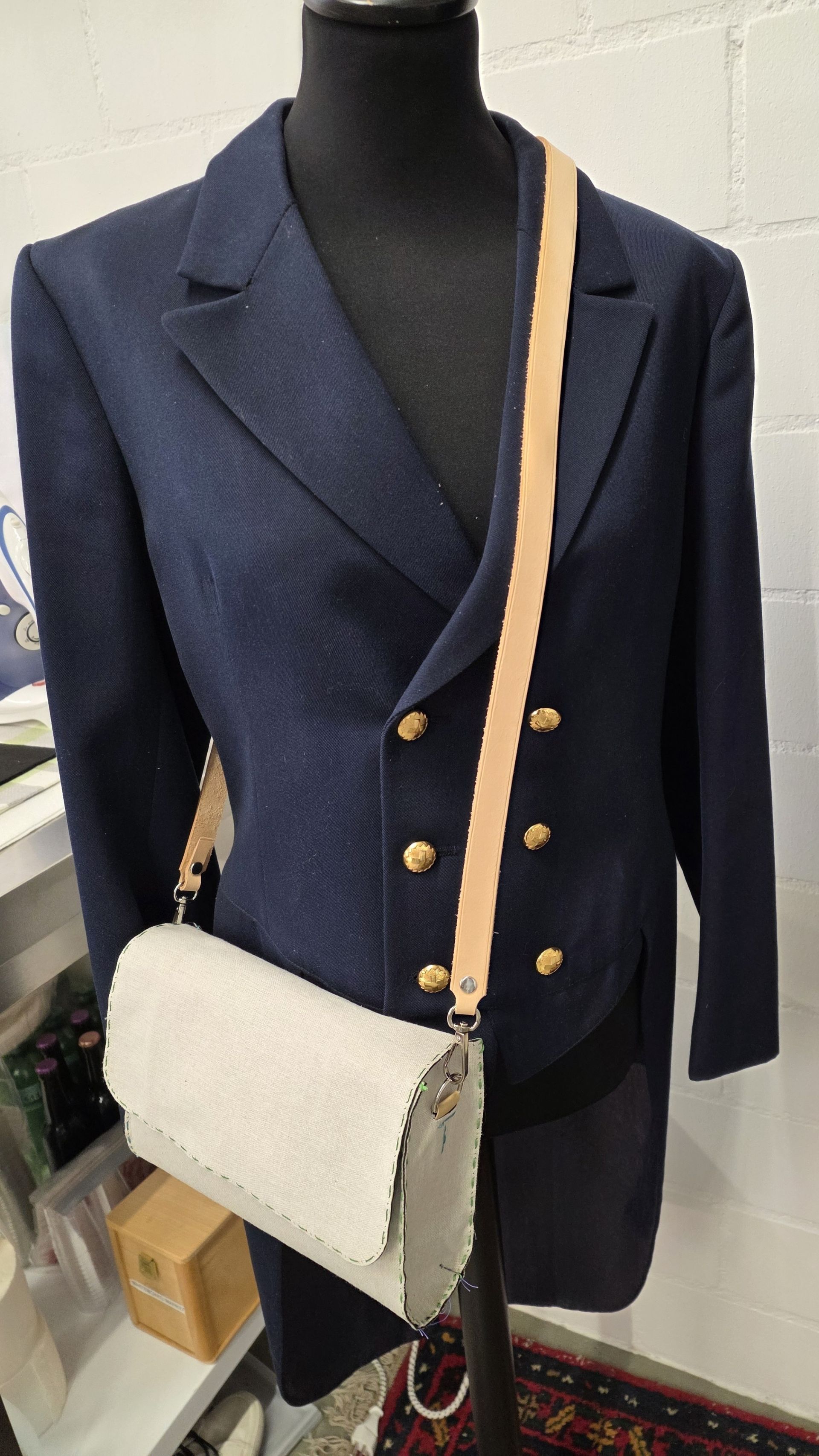 tailor's dummy wearing a fabric mock up for fitting.