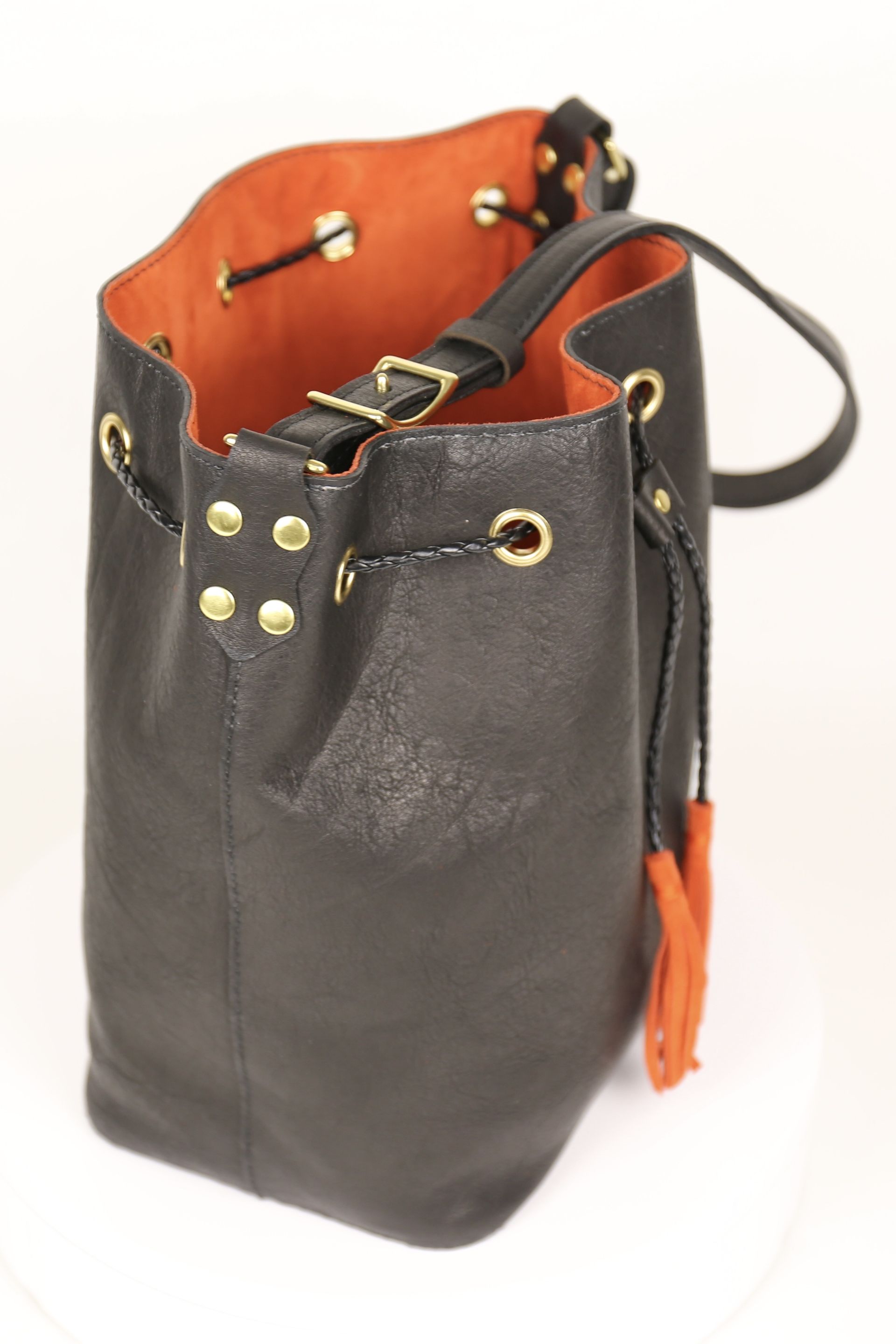 black bucket side view with coral red lining