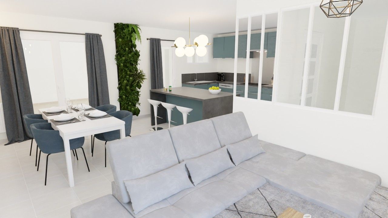 Espace de vie à aire ouverte : canapé gris, table à manger, cuisine bleue, jardin vertical et grandes fenêtres.