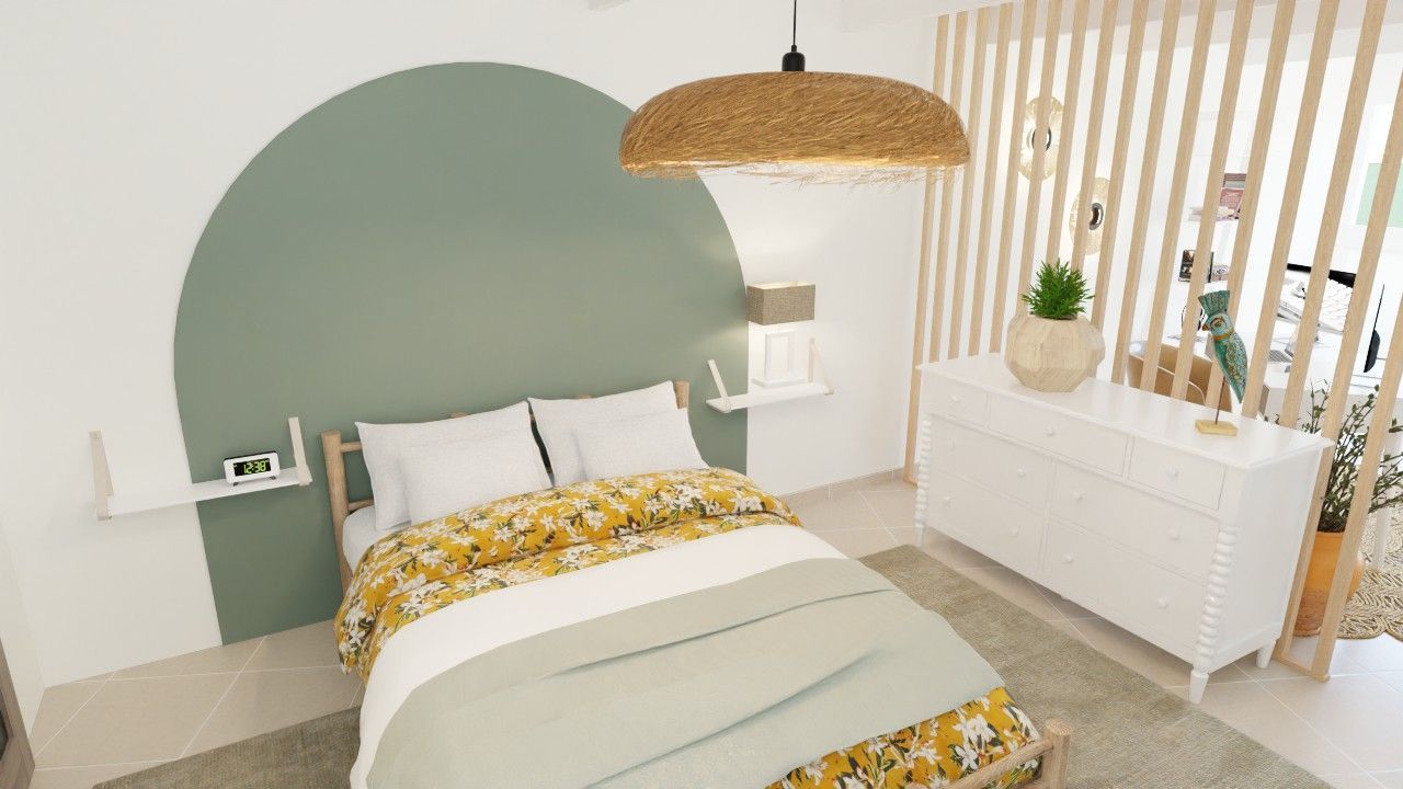 Une chambre avec un lit, une commode et une lampe.